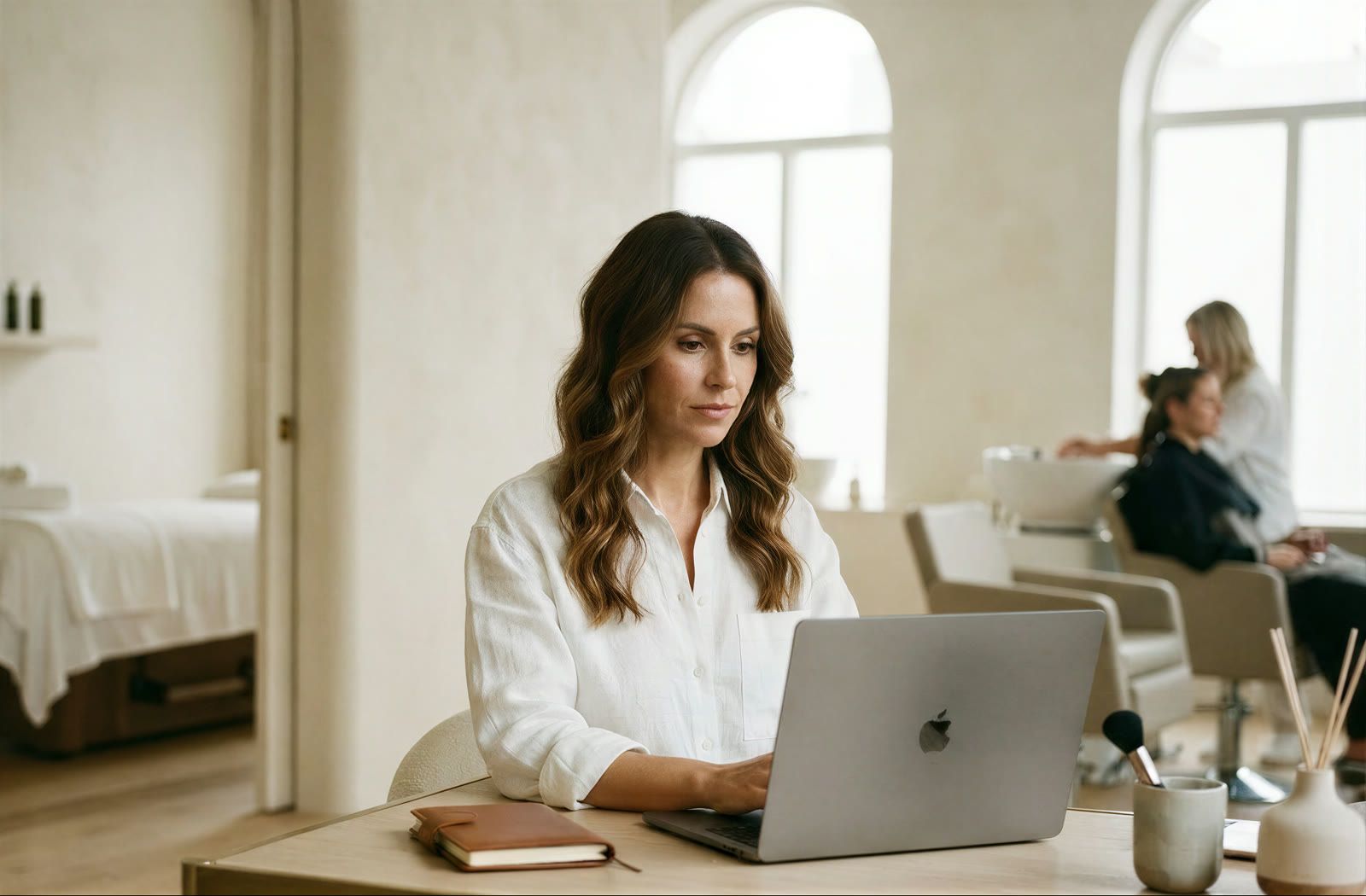 Salon professional working at a laptop