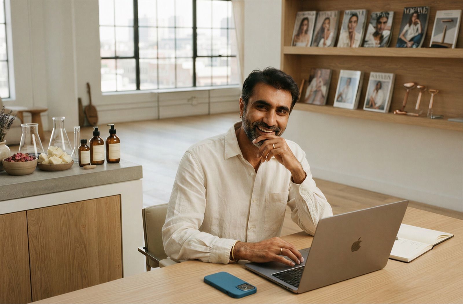 Brand founder at a desk with product samples