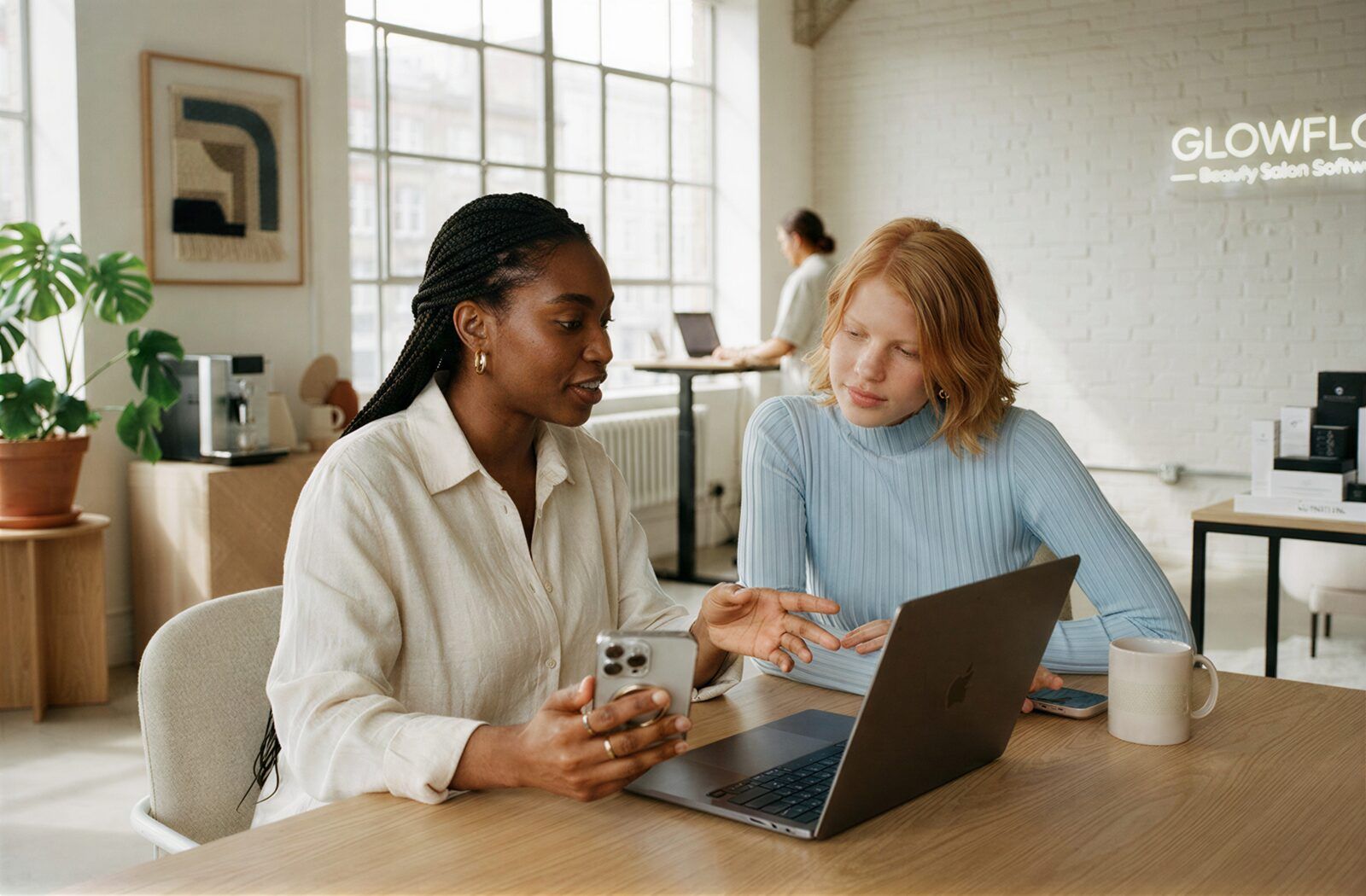 Salon software team collaborating on a laptop